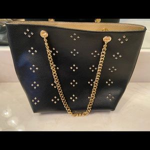 Two purses in one! Built in IPhone charger.